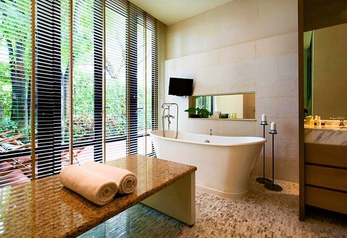 Grand Hyatt Erawan Bangkok gay-friendly hotel bathroom. Bathtub, towels, & view. Luxury for gay travelers in Bangkok.