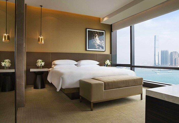 Grand Hyatt Hong Kong gay-friendly hotel room. Modern decor, city view, king bed. Luxury travel for gay men in Hong Kong.