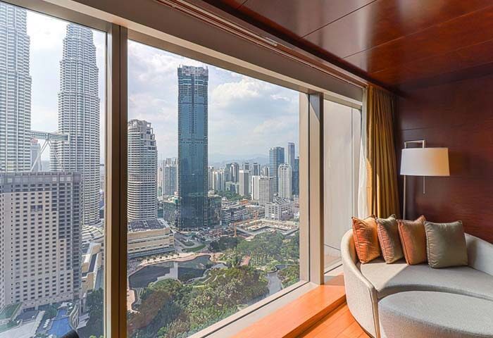 Grand Hyatt Kuala Lumpur hotel room view. Petronas Towers and KL skyline visible. A gay-friendly hotel choice in Kuala Lumpur.