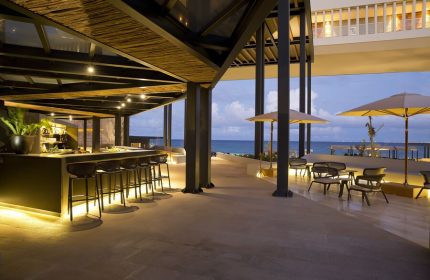 Grand Hyatt Playa Del Carmen Resort gay-friendly hotel bar. Outdoor seating, ocean view, and modern design. Perfect for gay travel in Playa del Carmen.