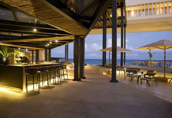 Grand Hyatt Playa Del Carmen Resort gay-friendly hotel bar. Outdoor seating, ocean view, and modern design. Perfect for gay travel in Playa del Carmen.
