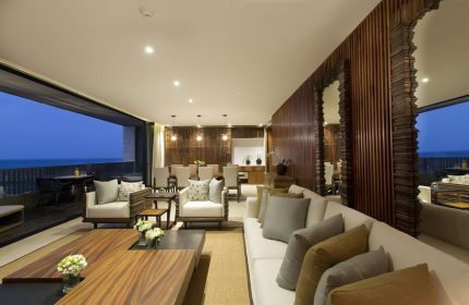 Grand Hyatt Playa Del Carmen Resort suite. Gay-friendly hotel living area with ocean view. Luxury travel for gay men.