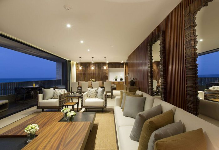 Grand Hyatt Playa Del Carmen Resort suite. Gay-friendly hotel living area with ocean view. Luxury travel for gay men.