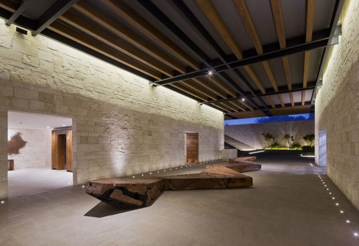 Grand Hyatt Playa Del Carmen Resort's lobby. This gay-friendly hotel boasts modern design, stone walls, wood accents, and inviting spaces.