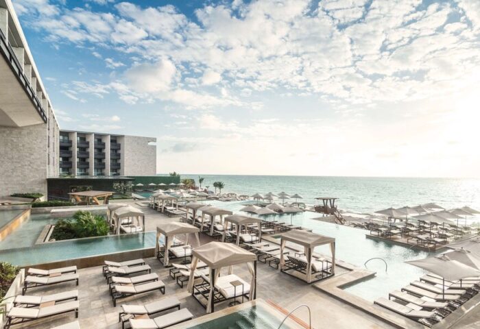 Grand Hyatt Playa Del Carmen Resort view. Gay-friendly hotel with pools, beach access, sun loungers, and cabanas. Ideal for gay travel.