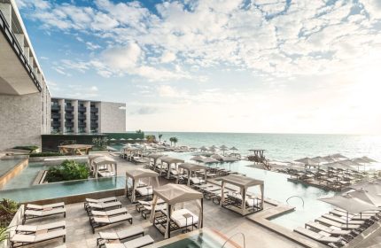 Grand Hyatt Playa Del Carmen Resort view. Gay-friendly hotel with pools, beach access, sun loungers, and cabanas. Ideal for gay travel.