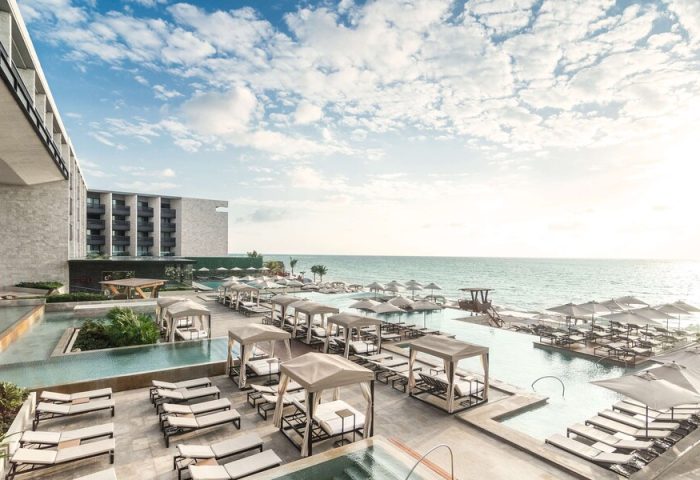 Grand Hyatt Playa Del Carmen Resort view. Gay-friendly hotel with pools, beach access, sun loungers, and cabanas. Ideal for gay travel.