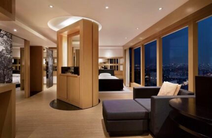 Grand Hyatt Seoul gay-friendly hotel room. Modern design with city view, seating area, and bed. Upscale gay travel accommodations in Seoul, South Korea.