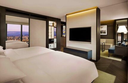 Grand Hyatt Seoul gay-friendly hotel room. Modern design, city view, large TV, comfortable seating. Perfect for gay travelers in Seoul.
