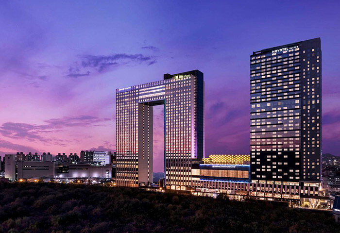 Grand Mercure Ambassador Hotel and Residences Seoul Yongsan, a gay-friendly hotel with unique architecture at dusk. Great for gay travel.