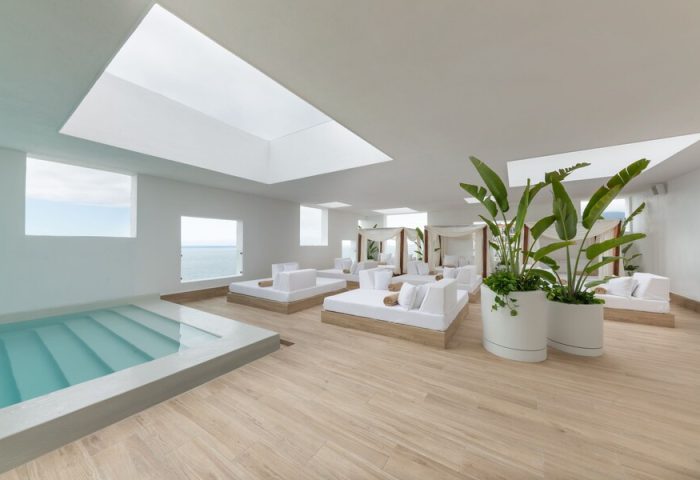 Grand Park Royal Puerto Vallarta All-Inclusive gay-friendly hotel spa. White lounge beds, jacuzzi, and ocean views in a luxury resort setting.