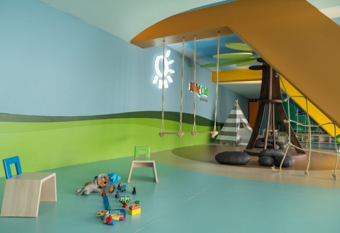 Grand Park Royal Puerto Vallarta All Inclusive gay-friendly hotel kids club. Play area with swings, slide, and toys for children.