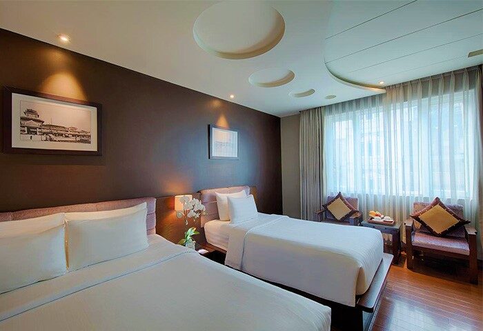 Grand Silverland Hotel room with two beds. Gay-friendly hotel featuring modern room design and comfortable amenities. Ideal for gay travelers.