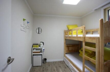 Guest House DODAMi's room. Gay-friendly hotel with bunk beds, mini fridge, kettle, and hangers. Ideal for gay men travelers in Korea.