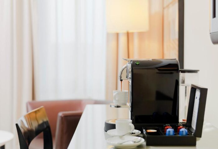 H10 Berlin Ku'damm Hotel room detail: Nespresso machine. Gay-friendly hotel in Berlin's Kudamm area offers in-room coffee for guests.