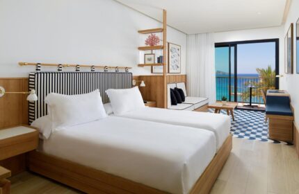 H10 Porto Poniente 4* Sup hotel room. Gay-friendly hotel with twin beds, balcony, sea view. Stylish interior, perfect for gay travel.