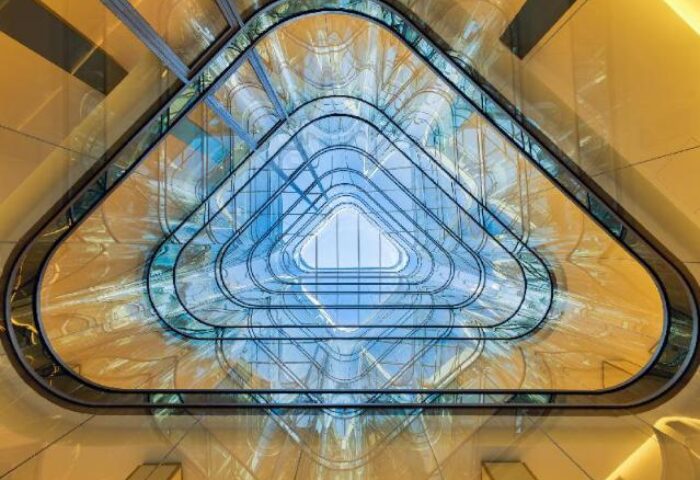 Architectural detail of H10 The One Barcelona, a gay-friendly hotel. View of the building's unique triangular glass atrium and skylight.