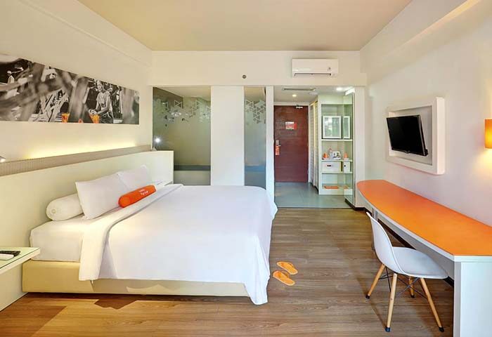 HARRIS Hotel Seminyak room. Modern interior with bed, desk, and TV. Gay-friendly hotel for travelers in Seminyak, Bali.