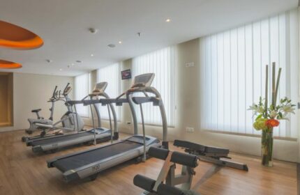 Gym at HARRIS Hotel Seminyak, a gay-friendly hotel. Treadmills, exercise bike, and weight bench. Fitness center for gay travelers in Seminyak.