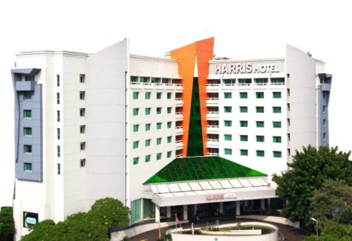 HARRIS Hotel Tebet exterior. Gay-friendly hotel with modern architecture, green accents, and lush landscaping. A welcoming choice for gay travelers.