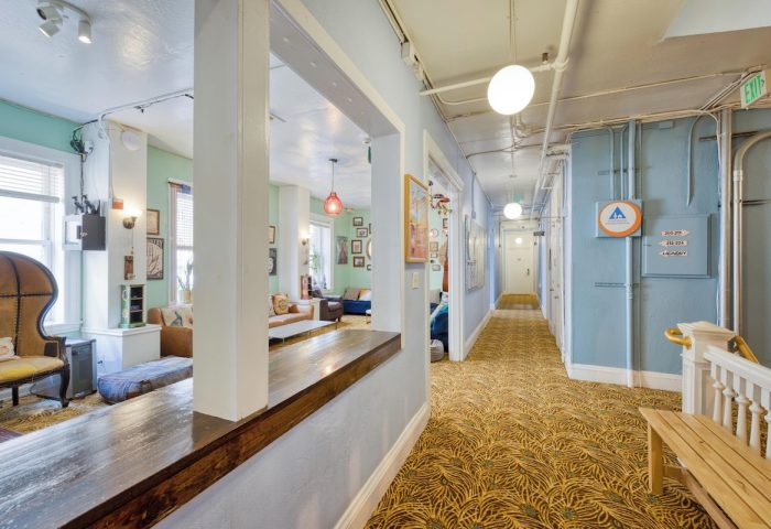 HI San Francisco Downtown Hostel interior. Gay-friendly hotel with a cozy lounge area and hallway. Great for gay men travel.