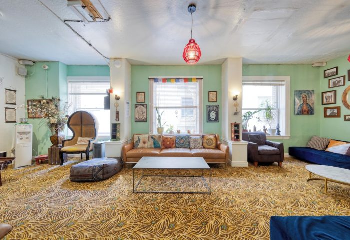 HI San Francisco Downtown Hostel's lounge area. Gay-friendly hotel with colorful decor, sofas, and a relaxed atmosphere. Perfect for LGBT travel.