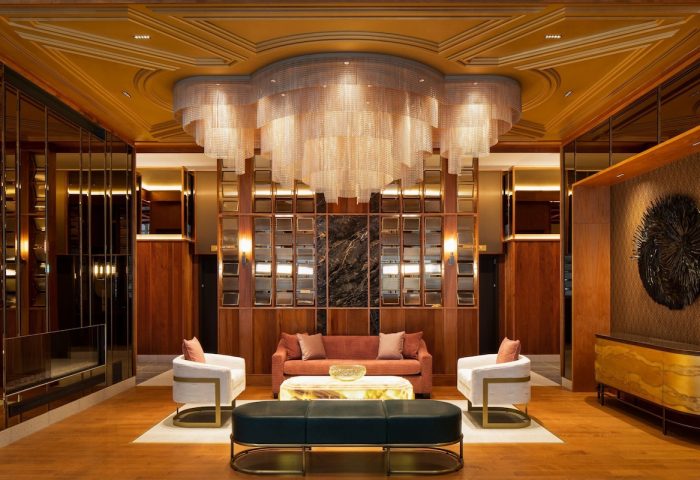 HONEYROSE Hotel Montreal lobby. A gay-friendly Tribute Portfolio Hotel with stylish seating, chandelier, and modern design. Upscale travel.