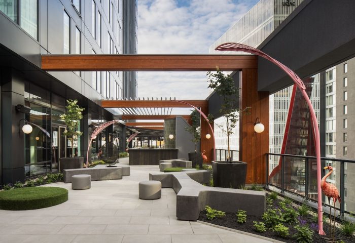 HONEYROSE Hotel Montreal patio. Gay-friendly Tribute Portfolio Hotel with outdoor seating, plants, and modern design. Great for gay travelers.