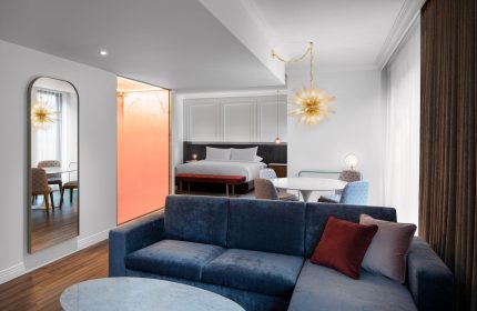 HONEYROSE Hotel, a Tribute Portfolio Hotel in Montreal. Gay-friendly rooms with a bedroom, living room, and dining area. Modern design.
