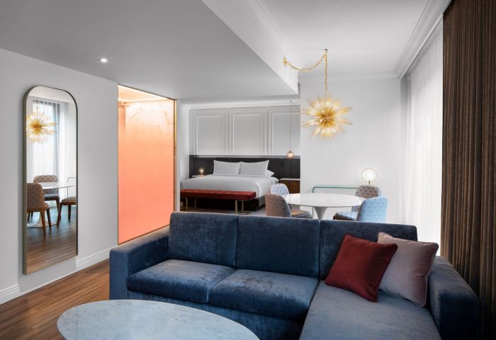 HONEYROSE Hotel, a Tribute Portfolio Hotel in Montreal. Gay-friendly rooms with a bedroom, living room, and dining area. Modern design.
