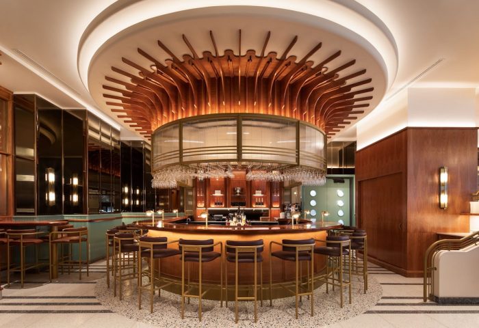 HONEYROSE Hotel Montreal bar. Gay-friendly Tribute Portfolio Hotel with circular bar, stylish lighting, and glasses. A great place to meet.