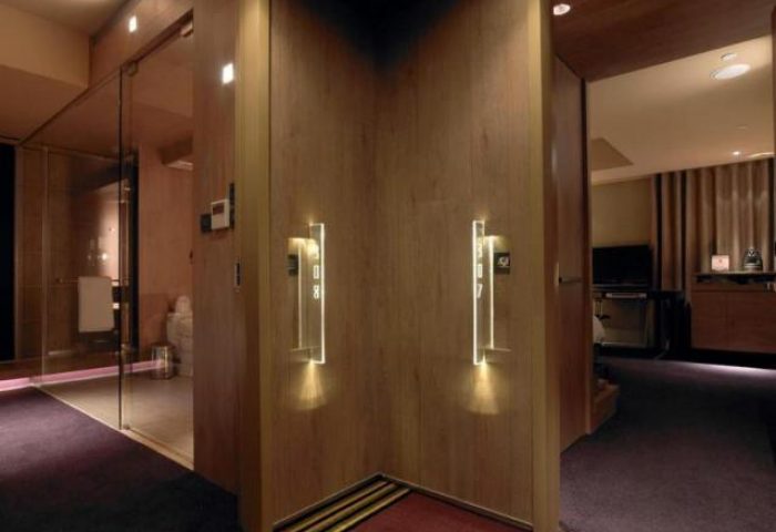 HOTEL QUOTE Taipei room entrance. Gay-friendly hotel with modern design. Room number lit. Luxury lodging for gay travelers in Taipei.