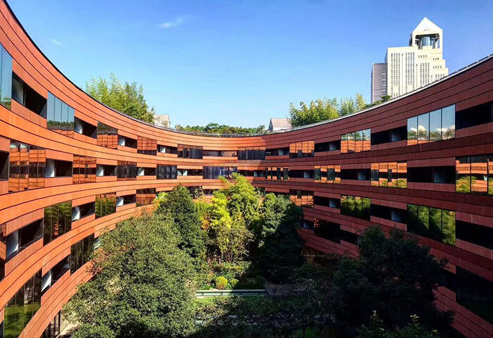 HUALUXE Shanghai Twelve At Hengshan hotel courtyard view. Gay-friendly hotel with modern architecture and lush greenery. Shanghai travel.