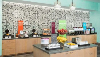 Breakfast bar at Hampton Inn & Suites Santa Monica, a gay-friendly hotel. Fresh fruit, waffles, and other options available.