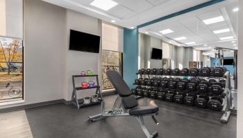 Hampton Inn & Suites by Hilton Toronto Downtown gym. Weight rack, bench, kettlebells. Gay-friendly hotel for travelers.