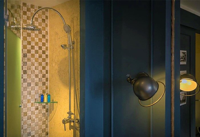 Hanoi La Siesta Trendy Hotel bathroom. Shower with mosaic tiles. Stylish lighting. Gay-friendly hotel in Hanoi for gay men travel.