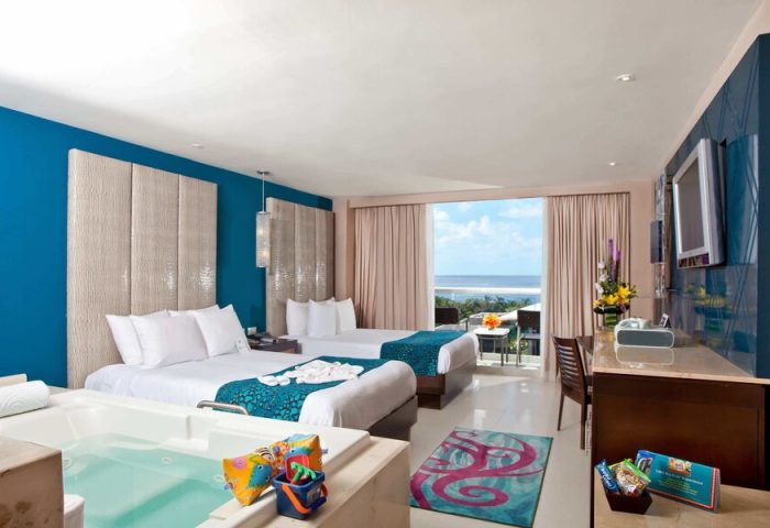 Hard Rock Hotel Cancun all-inclusive suite. Two beds, jacuzzi, ocean view. Gay-friendly hotel room. Family-friendly amenities.