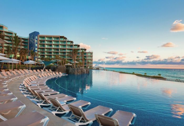 Hard Rock Hotel Cancun all-inclusive gay-friendly resort view. Infinity pool overlooking the ocean. Ideal for gay men's vacation.