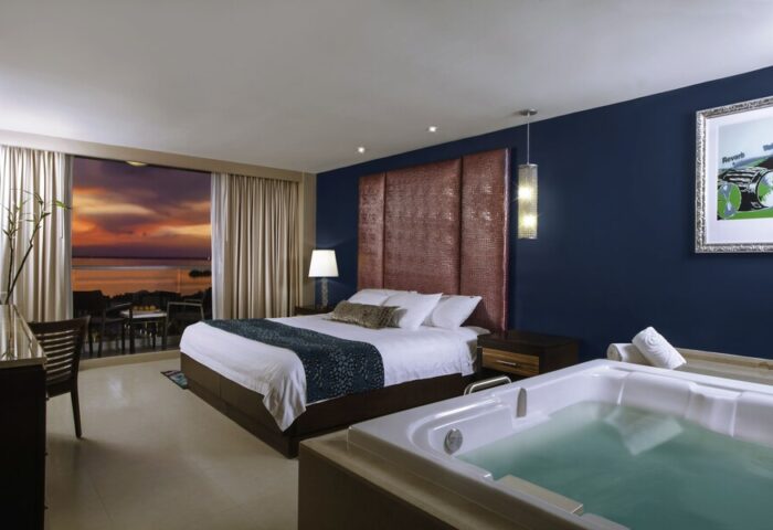Hard Rock Hotel Cancun all-inclusive gay-friendly room. King bed, jacuzzi, balcony view. A luxury gay vacation awaits in Cancun.