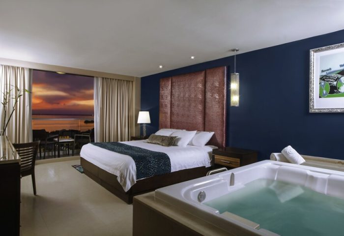 Hard Rock Hotel Cancun all-inclusive gay-friendly room. King bed, jacuzzi, balcony view. A luxury gay vacation awaits in Cancun.