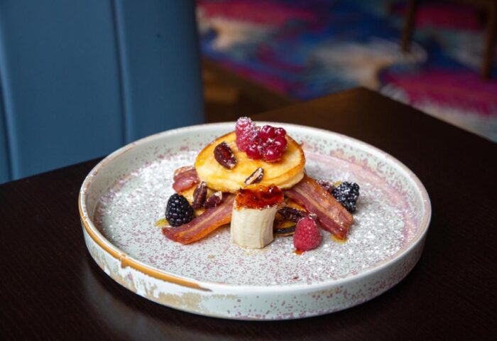 Pancakes, bacon, and berries at Hard Rock Hotel Dublin, a gay-friendly hotel. Delicious breakfast for gay travelers.