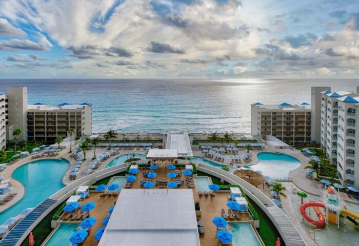 Hilton Cancun Mar Caribe All-Inclusive Resort view. Gay-friendly hotel pools, beach, and ocean. Perfect for LGBTQ+ travel.
