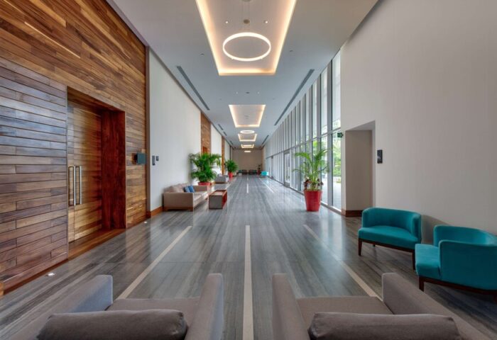 Hilton Vallarta Riviera All-Inclusive Resort's interior. Modern design, wood accents, stylish seating. A gay-friendly hotel with luxury amenities.