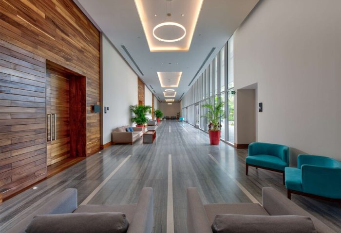 Hilton Vallarta Riviera All-Inclusive Resort's interior. Modern design, wood accents, stylish seating. A gay-friendly hotel with luxury amenities.