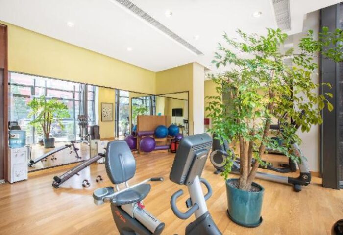 Holiday Inn Express Beijing Dongzhimen's gym. Gay-friendly hotel with exercise bikes, treadmills, & fitness equipment for a healthy stay.