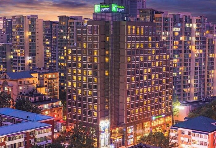 Holiday Inn Express Beijing Dongzhimen, a gay-friendly hotel. The building is surrounded by other buildings in the city.