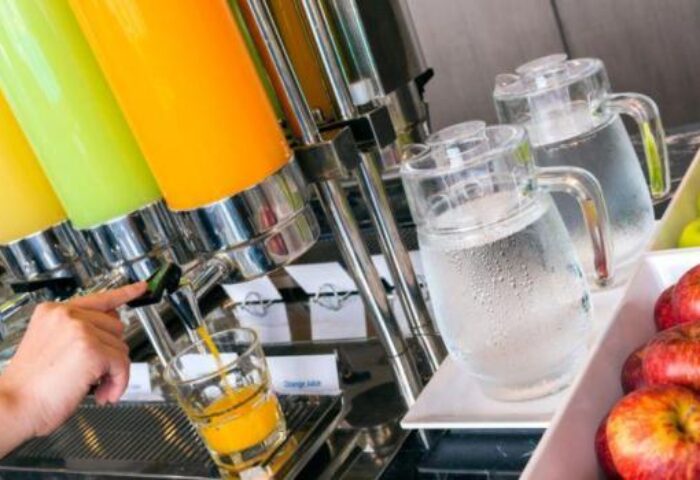 Holiday Inn Express Krabi Ao Nang Beach breakfast bar. Juices, water, & apples offer a refreshing start at this gay-friendly hotel.