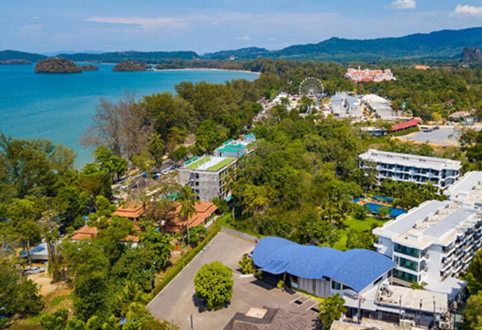Holiday Inn Express Krabi Ao Nang Beach aerial view. Gay-friendly hotel near the beach, featuring a pool, lush greenery, and ocean views.