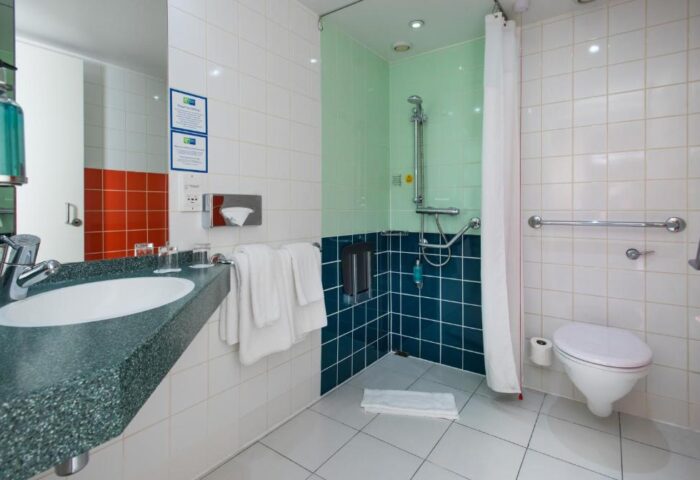 Bathroom at Holiday Inn Express London-Vauxhall-Nine Elms. Accessible shower, toilet, sink, and gay-friendly hotel amenities.