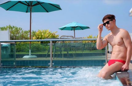 Holiday Inn Express Pattaya Central gay-friendly hotel: Man in swim briefs at the pool. Perfect for gay travel in Pattaya, Thailand.